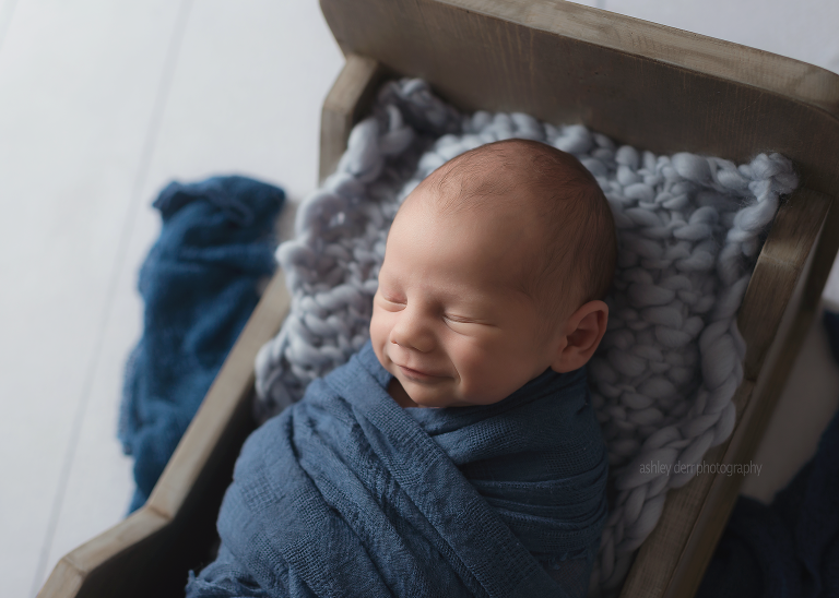newborn photography baby smiling